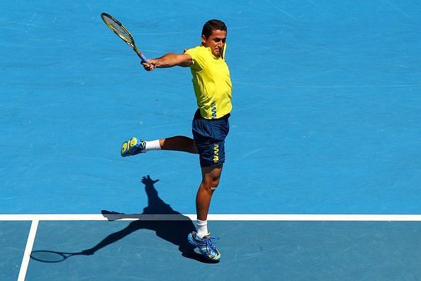 Nicolas Almagro in motion hitting his famous one-handed backhand