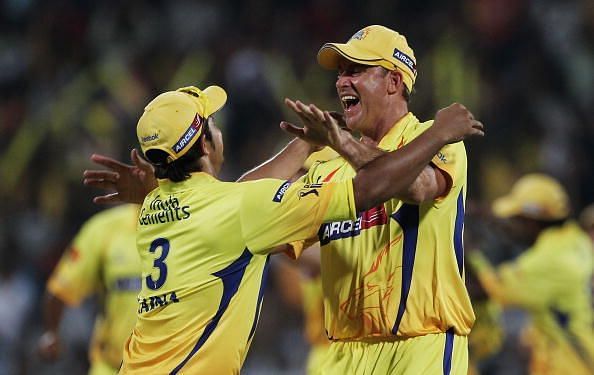 Suresh Raina and Matthew Hayden celebrate a wicket for CSK