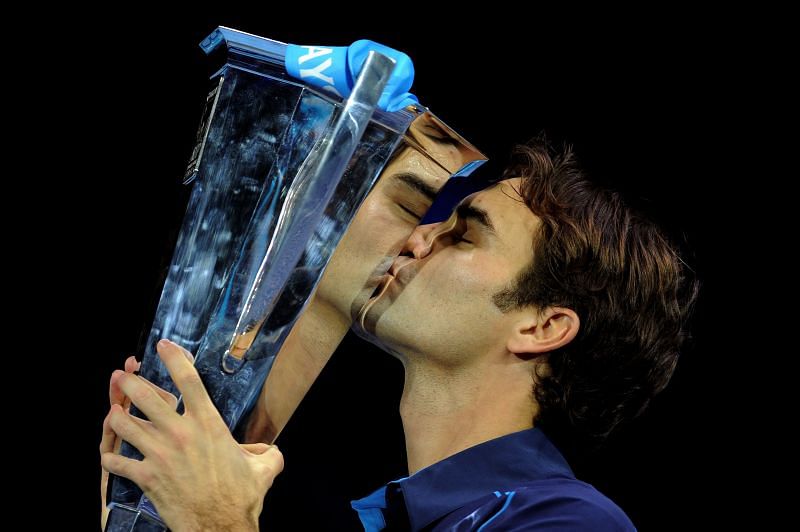 Roger Federer with the 2011 World Tour Finals trophy