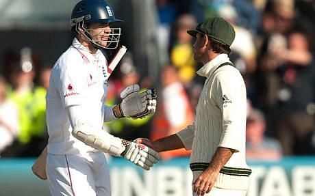 James Anderson shakes hands with Ricky Ponting at the end of play