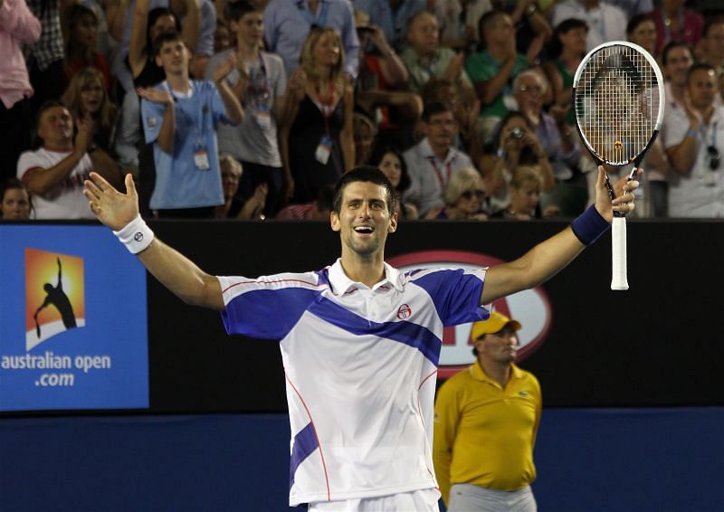 Novak Djokovic exults after winning the 2011 Madrid Masters title