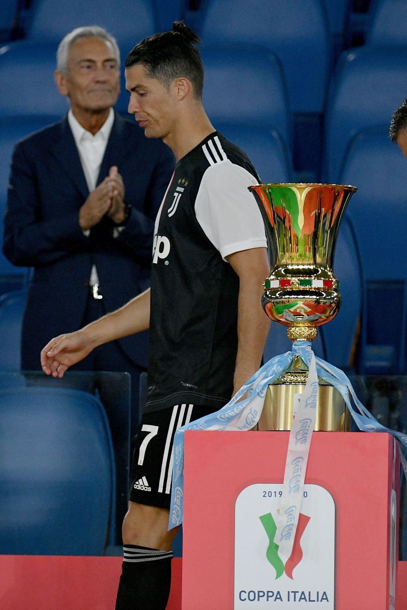 A dejected Cristiano Ronaldo walks away from the Coppa Italia trophy. Juventus were beaten 4-2 on penalties by Gennaro Gattuso&#039;s Napoli.