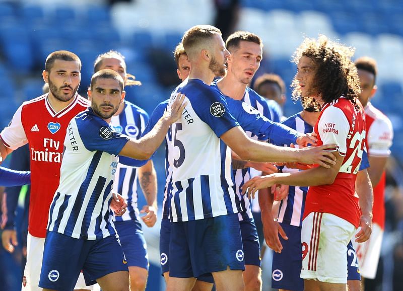 Guendouzi in a tussle with Maupay, Ben Dunk, and other Brighton players