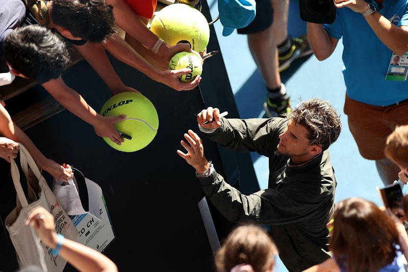 Dominic Thiem giving fans autographs during the 2020 Australian Open