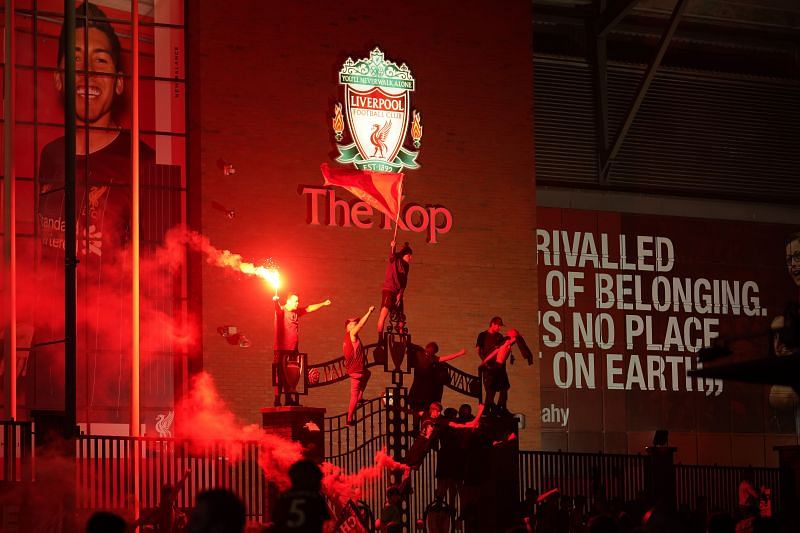 Liverpool fans burst into wild celebrations after the side won its first EPL title in 30 years