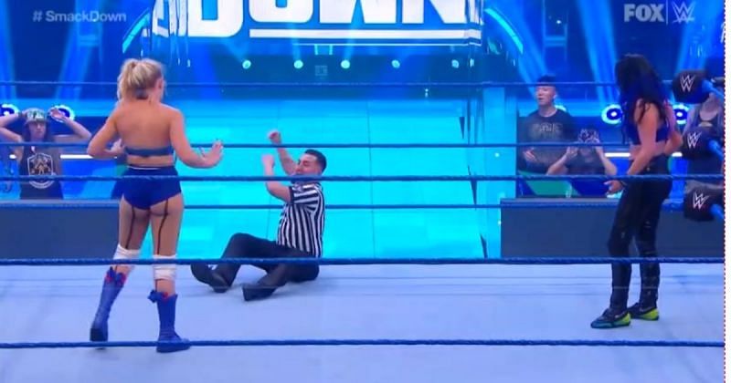 The referee called for help after Sonya Deville slid into his knee.