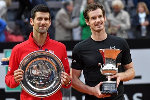 Novak Djokovic poses with his 2016 Roland Garros trophy.