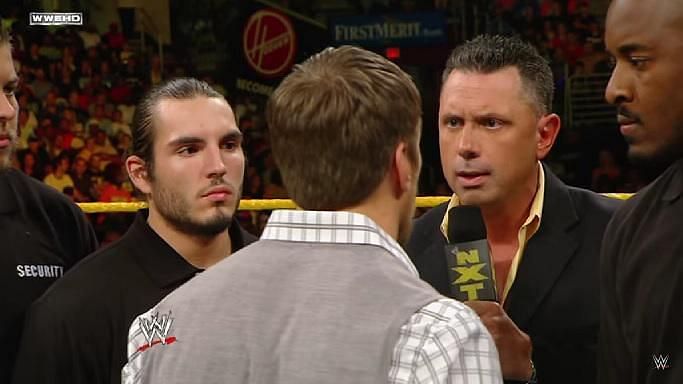 Johnny Gargano (left) staring at Daniel Bryan