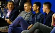 Nikola Jokic (second from left) beside Novak Djokovic at the basketball game