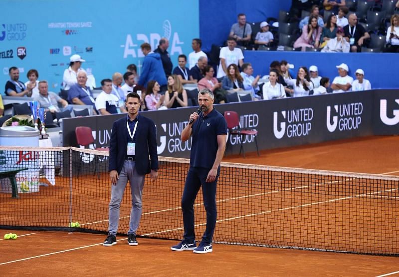 Goran Ivanisevic, Novak Djokovic&#039;s coach, has tested positive for COVID-19, bringing Dominic Thiem under scrutiny as well