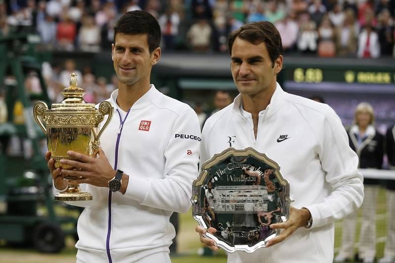 Novak Djokovic poses with his third Wimbledon title in 2015