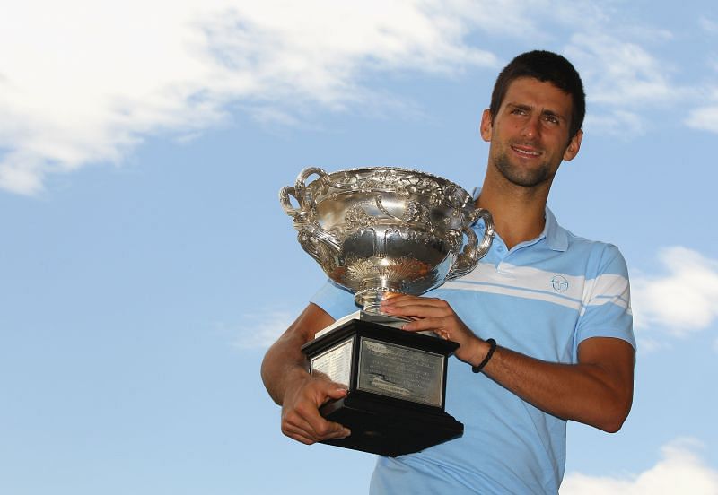 Novak Djokovc with the Australian Open 2011 trophy, which ended his 3-year Grand Slam drought