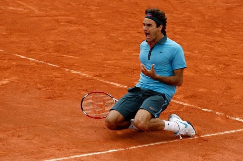 Roger Federer sinks to his knees after sealing his maiden Roland Garros title in 2009