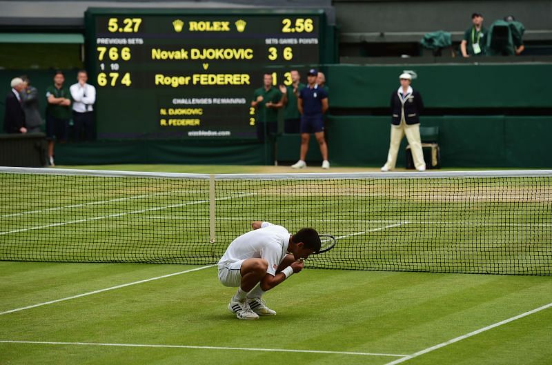 Novak Djokovic savoring the grass at Center Court - a tradition he has followed since Wimbledon 2011