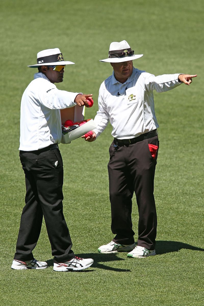 Nitin Menon with Australian umpire John Ward