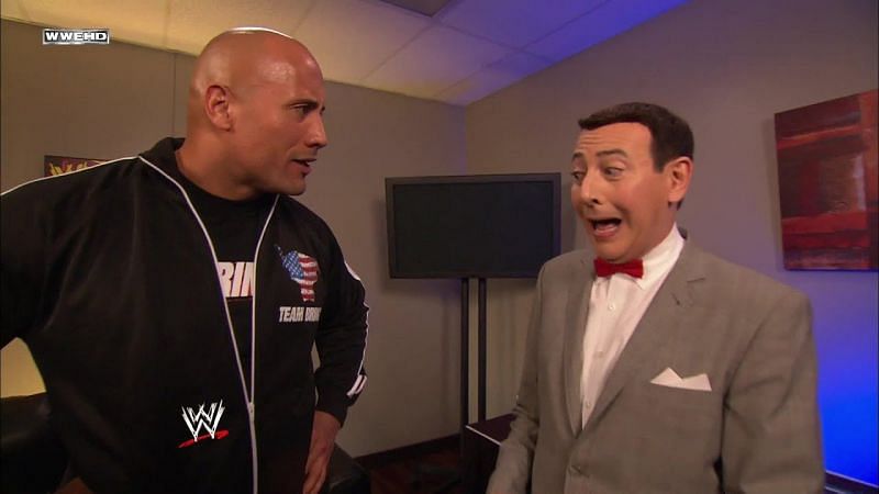 Pee Wee Herman, icon of comedy, stands next to the Rock, Icon of Pro Wrestling and Hollywood.