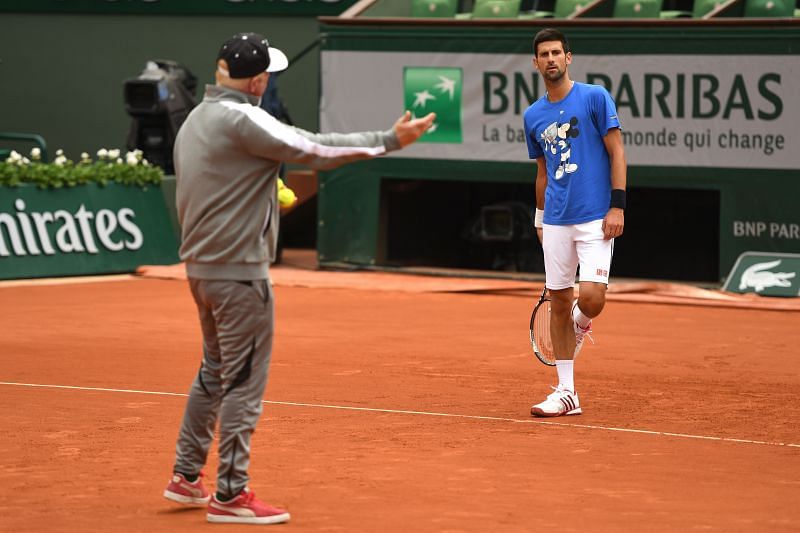 Novak Djokovic practising under the watchful eyes of Boris Becker