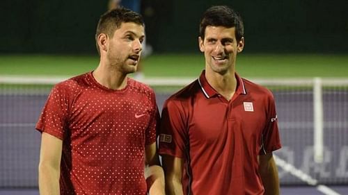 Novak Djokovic (right) lost to Filip Krajinovic in his Adria Tour singles opener