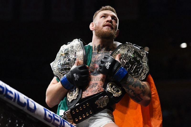 Conor McGregor with his two-division world titles