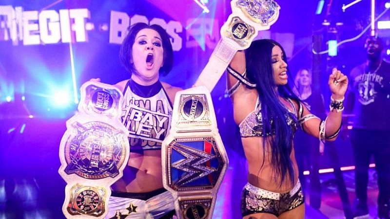 Sasha Banks and Bayley pose with the Women&#039;s Tag Championships