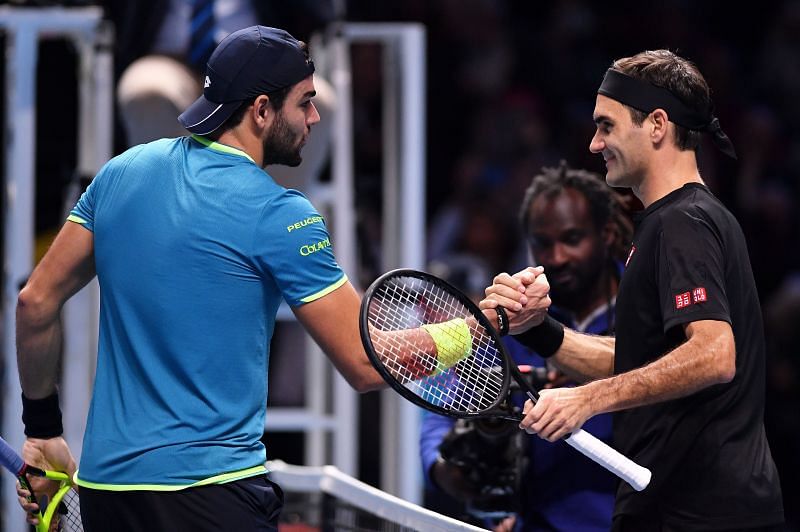 Matteo Berrettini (L) and Roger Federer at Nitto ATP Finals 2019