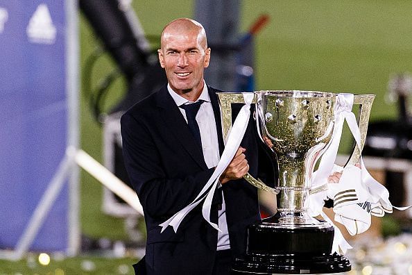 Real Madrid manager Zinedine Zidane celebrates with the La Liga trophy