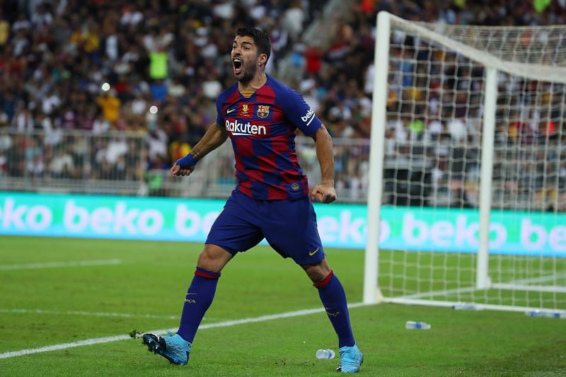 Luis Suarez celebrates a La Liga goal for Barcelona.