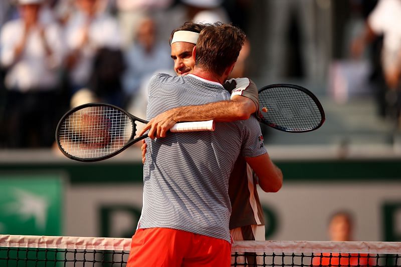 Stan Wawrinka embraces Roger Federer at Roland Garros 2019