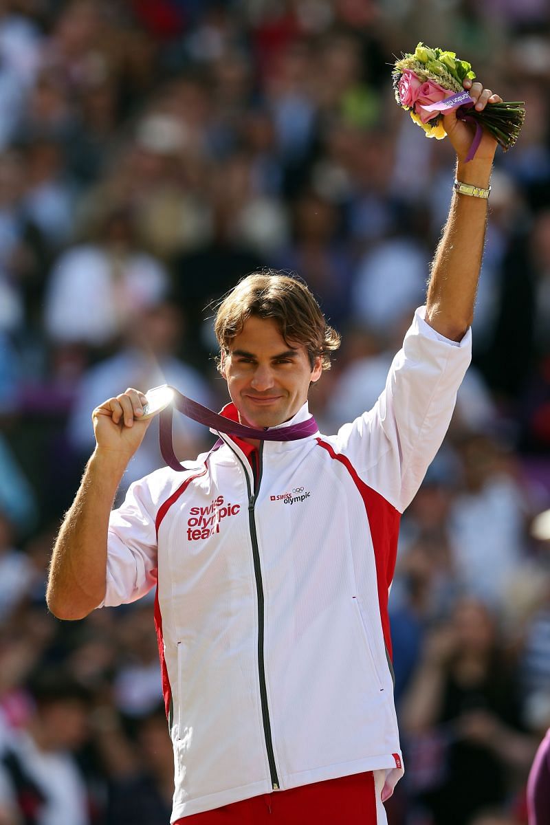 Roger Federer with his Olympics Silver medal from 2012