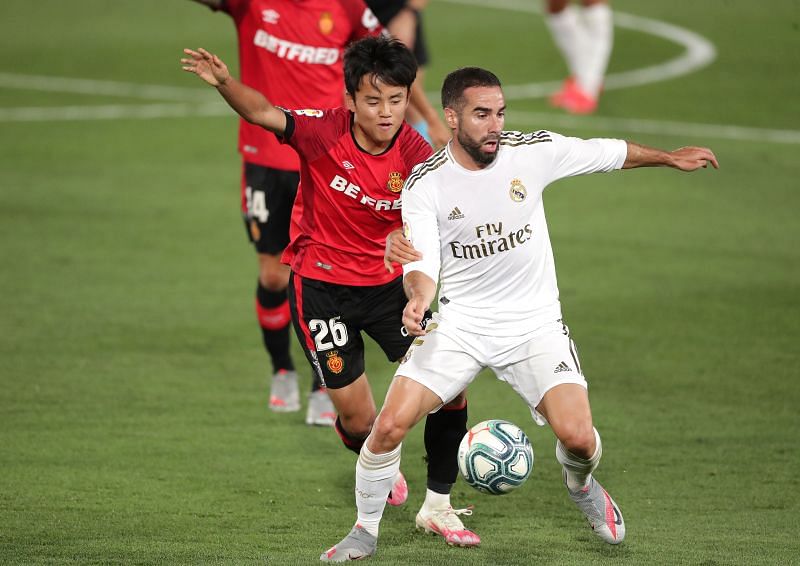 Dani Carvajal shielding the ball from on-loan Real wonderkid Takefusa Kubo