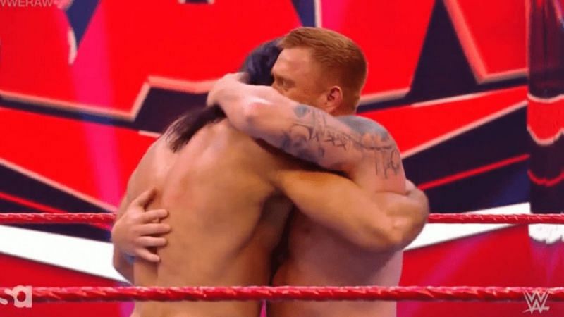 Drew McIntyre and Heath Slater hug it out at the end of their Raw segment this Monday