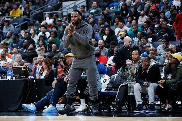 LeBron James cheering Bronny from the sidelines during a high school game