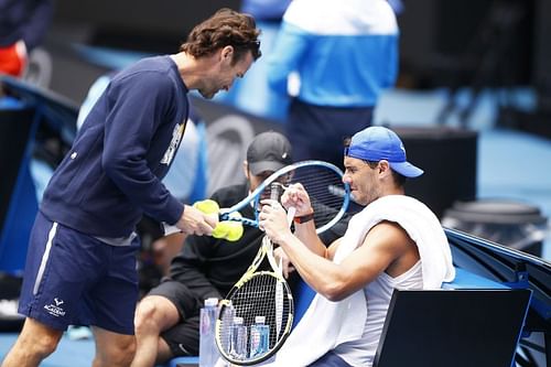 Rafael Nadal with coach Carlos Moya (left)