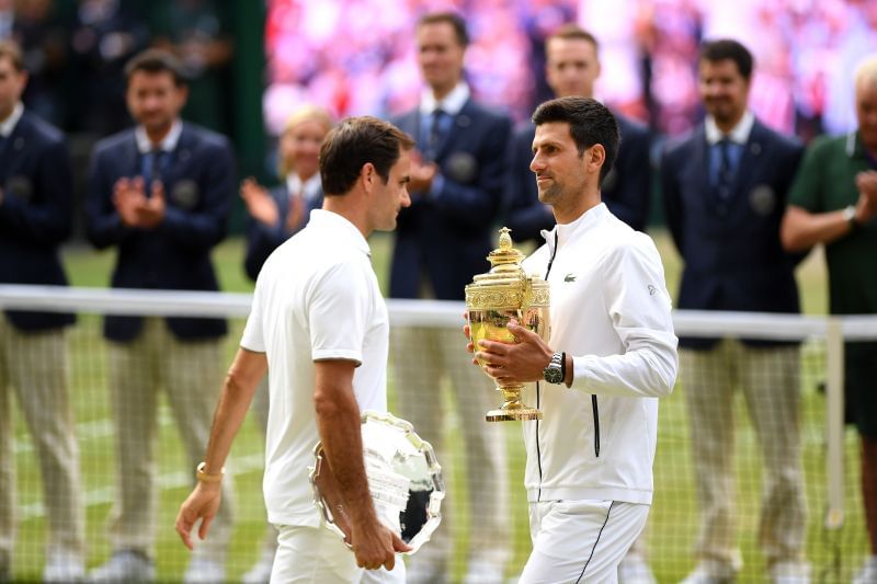 Roger Federer (L) and Novak Djokovic at Wimbledon 2019