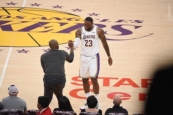 Kobe Bryant watches LeBron lead the Lakers earlier this year
