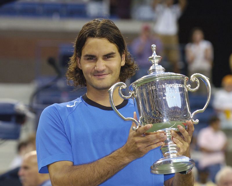 Roger Federer poses with the 2004 US Open trophy