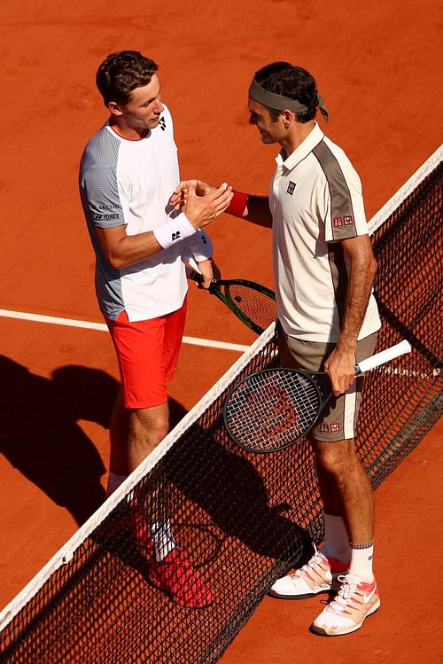 Casper Ruud (L) and Roger Federer at the French Open 2019