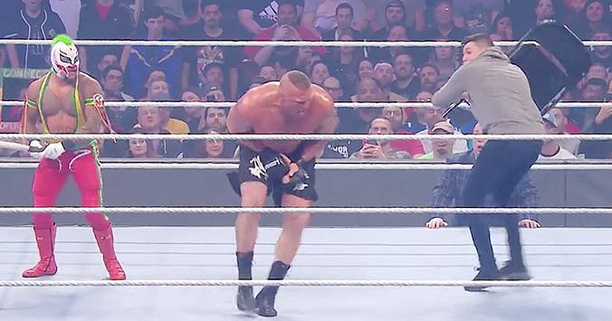 Rey Mytserio and his son attacking Brock Lesnar