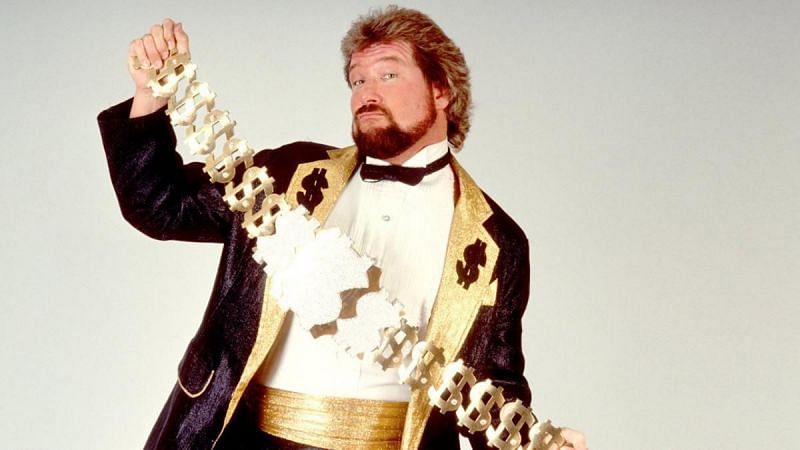 Ted DiBiase holding up his prized Million Dollar Belt