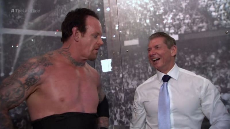 The Undertaker and Vince McMahon in a backstage area