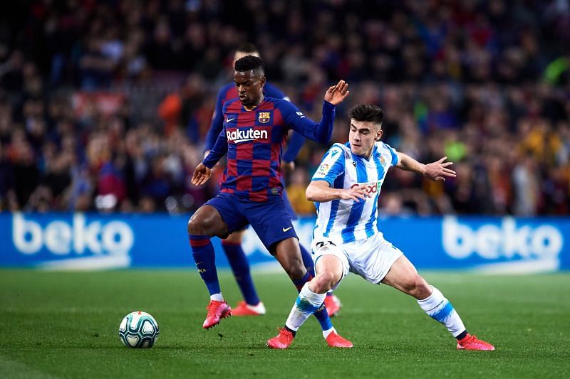 Nelson Semedo of FC Barcelona competes for the ball with Ander Barrenetxea of Real Sociedad