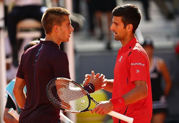 Novak Djokovic shakes hands with Borna Coric