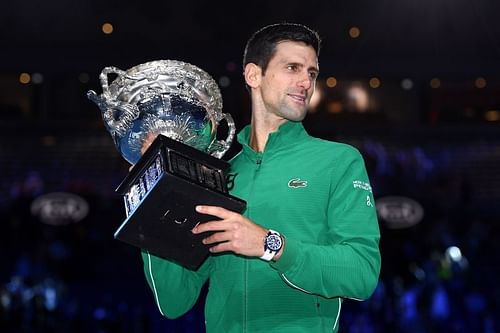 Novak Djokovic poses with the 2020 Australian Open title