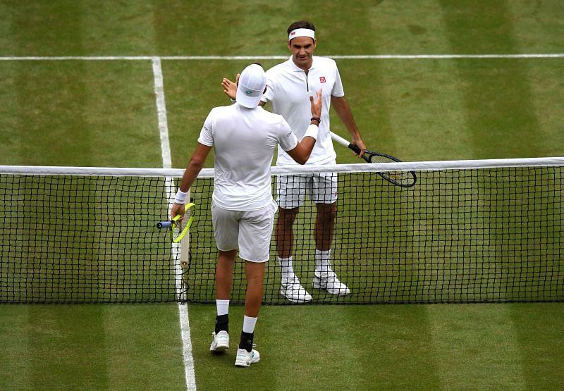 Matteo Berretini (L) and Roger Federer at Wimbledon 2019