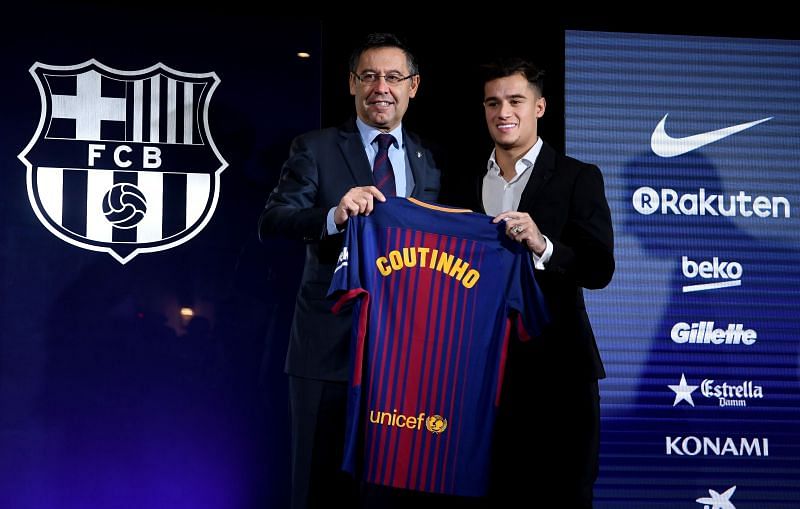 Barcelona president Josep Maria Bartomeu (left) presenting Philippe Coutinho. Bartomeu&#039;s extensive spending has hurt the club.