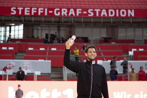 Dominic Thiem celebrates with the trophy after winning in Berlin