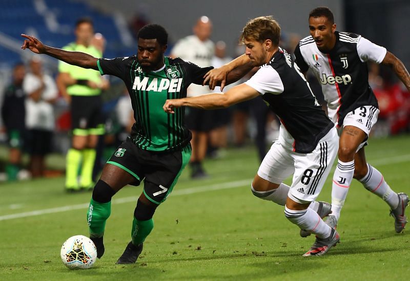 Jeremie Boga (left) competes for the ball with Aaron Ramsey during the game as Danilo looks on.