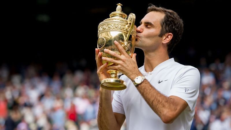 Roger Federer celebrates a record eighth Wimbledon title in 2017.