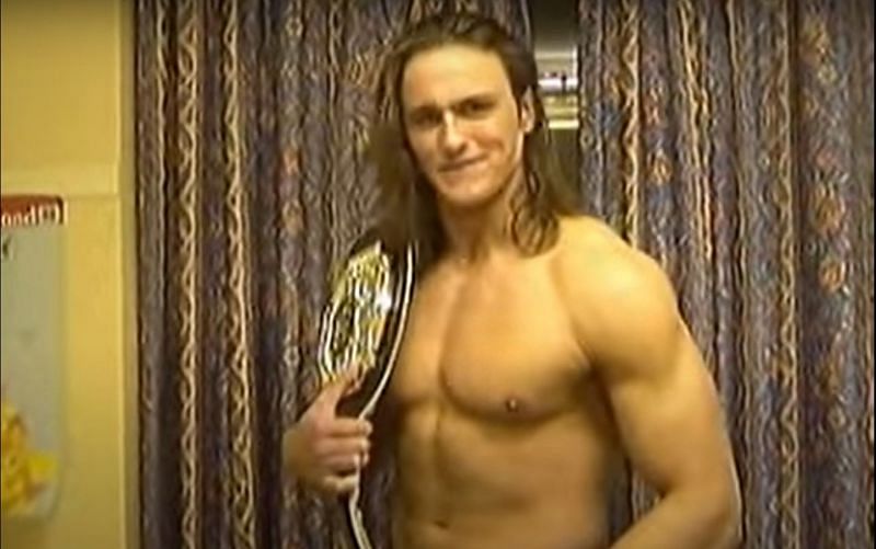 A rare photo of McIntyre as the Insane Championship Wrestling Champion.