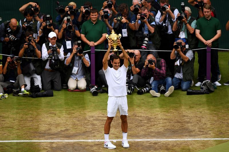 Roger Federer celebrates his record 8th Wimbledon title in 2017.